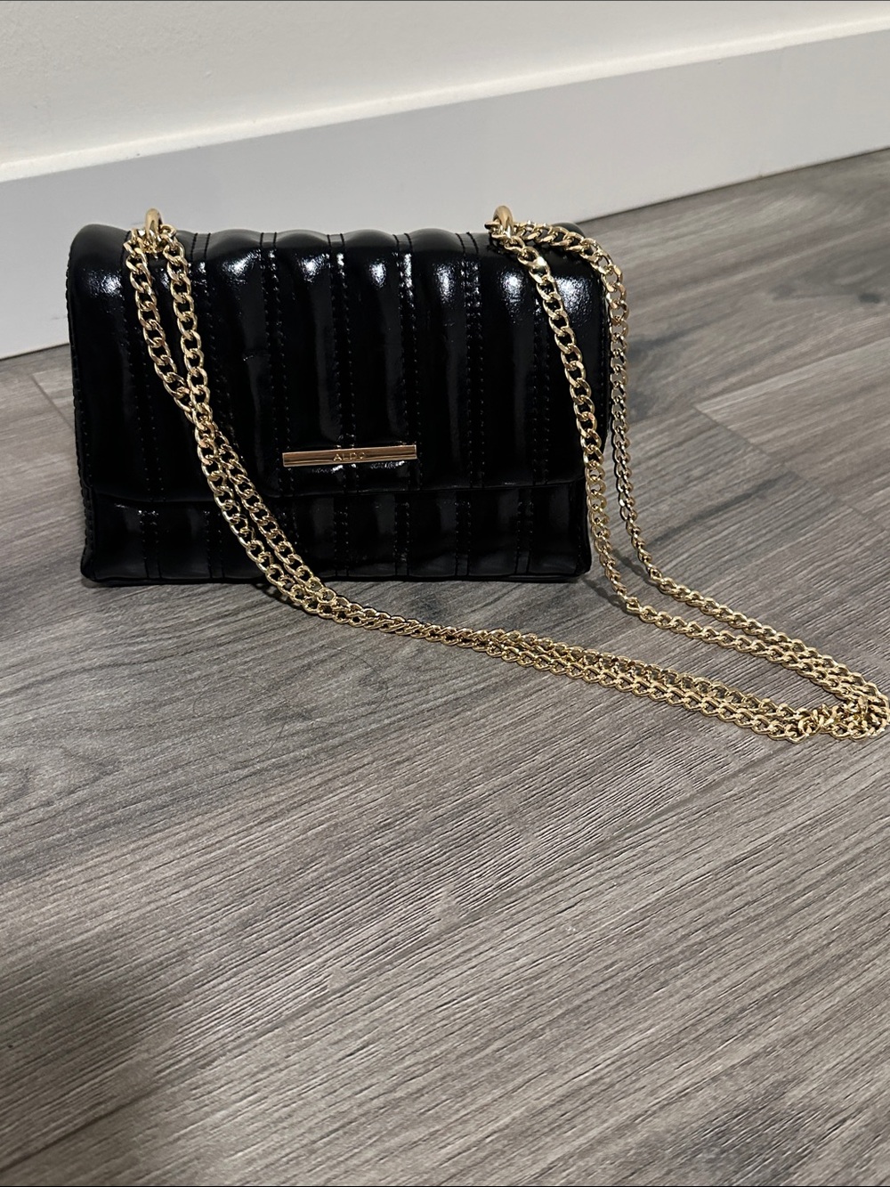 Aldo Sleek Black Quilted Crossbody with Gold Chain Strap